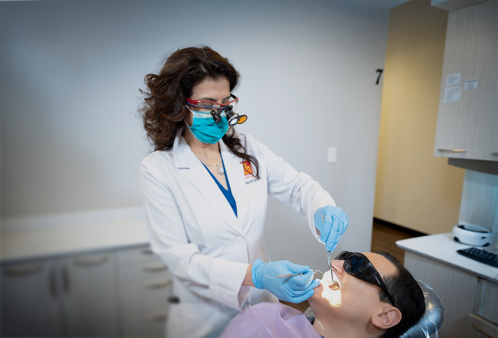 Dentist examining patient